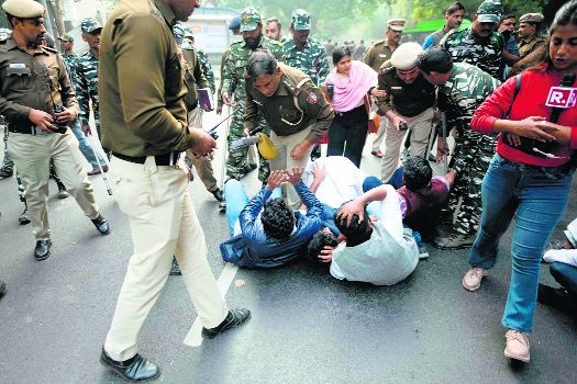 NSUI members clash  with cops during protest
