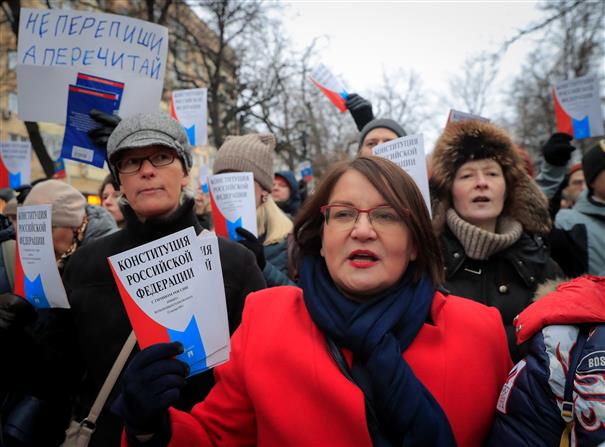 Russian activists take aim at Putin in march against repression