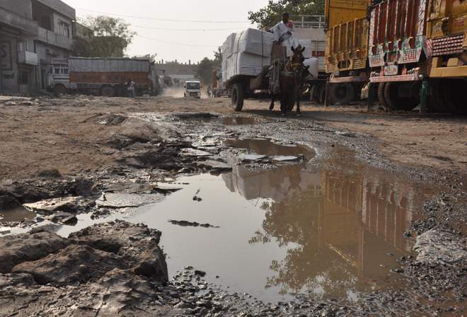 Potholed roads a bane for Transport Nagar