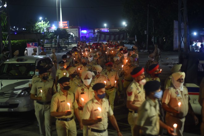 Candle march by cops in memory of martyrs