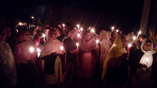 Residents hold candle march in support of farmers’ protest