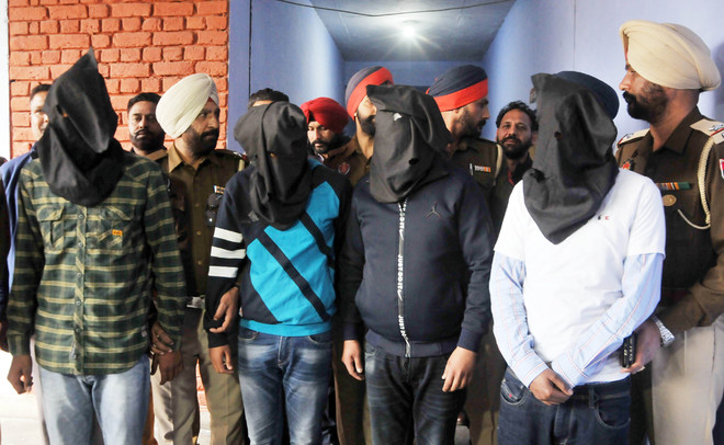 4 held with 2.3-kg heroin, two pistols
