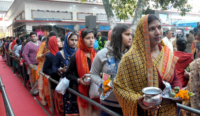 Devotees queue up at temples to seek Lord Shiva’s blessings