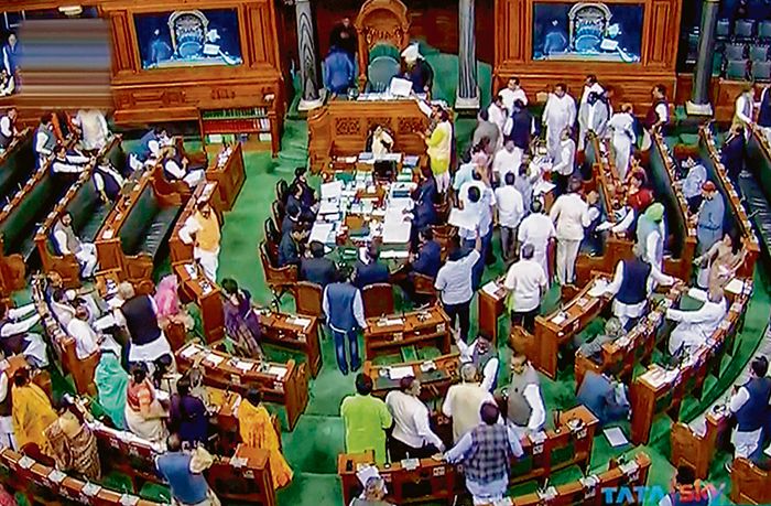 BJP, Cong members scuffle in House