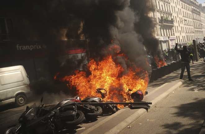 Riot police deployed as youths set cars ablaze in Paris suburbs