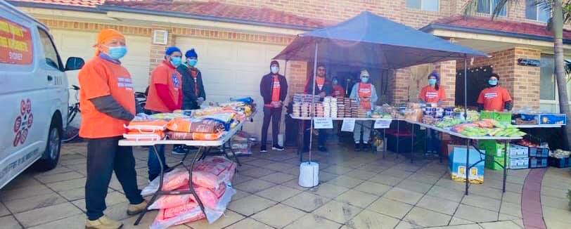 Sikhs prepare meals for 300 Australians who returned from New Delhi; story in pictures