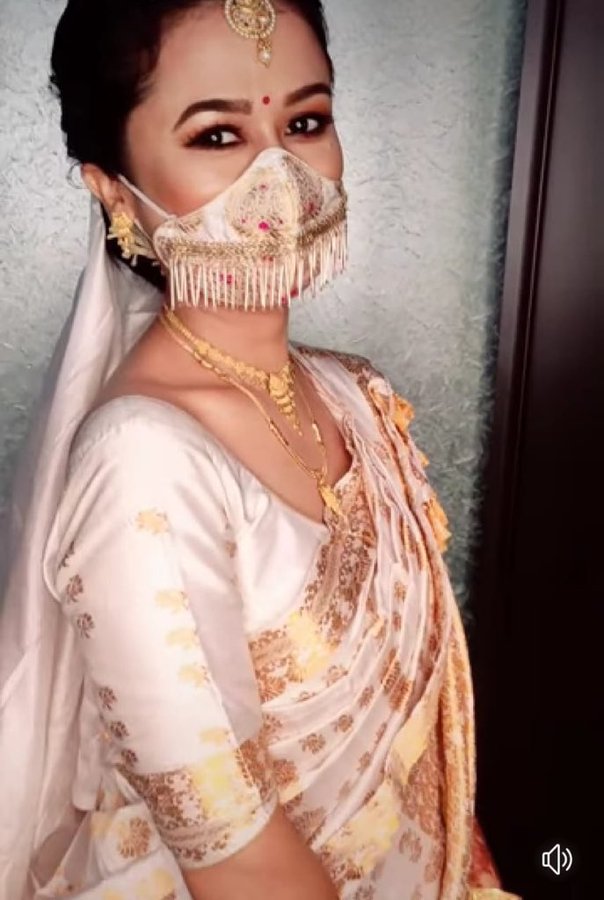 Assamese bride uses simple face mask as fashionable wedding accessory