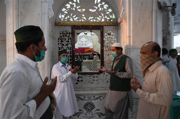 Virus fallout dampens spirits as Muslims mark major holiday
