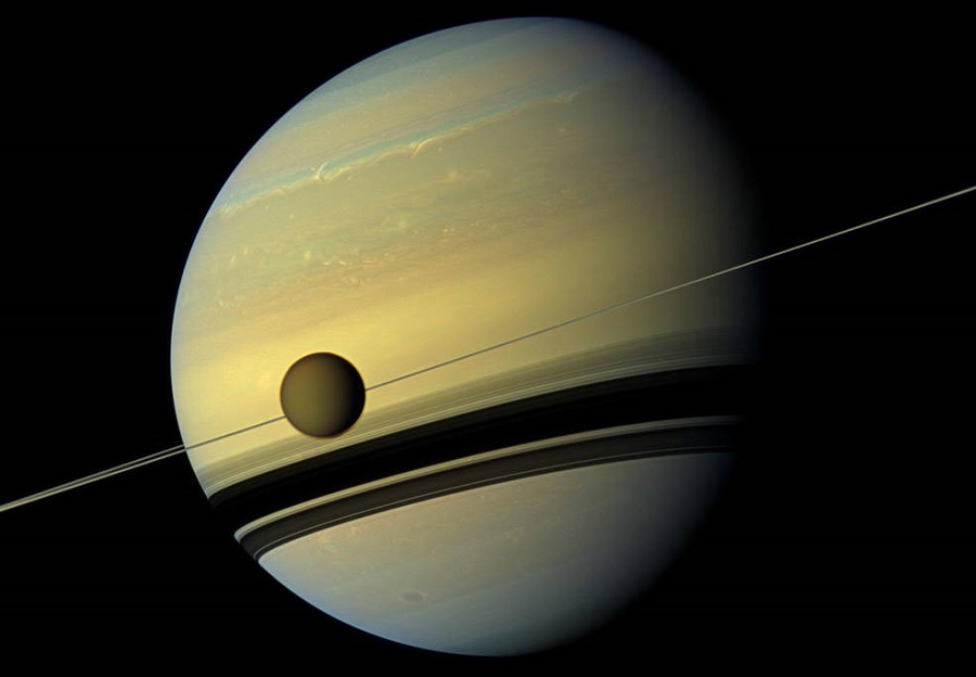 Saturn's moon Titan drifting away 100 times faster than thought