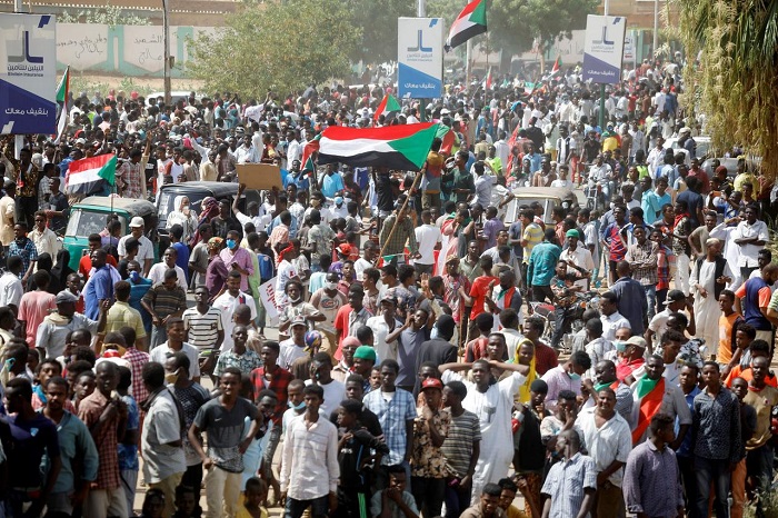 One killed in Sudan as thousands rally for faster reform