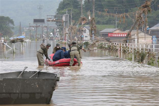 Japan floods leave up to 34 dead, many at nursing homes