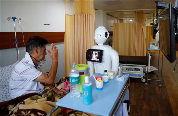 Mitra the robot helps COVID patients in India speak to loved ones
