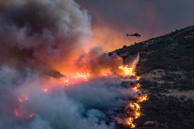 Greenhouse gas, air pollution cause distinct regional impacts on extreme fire weather