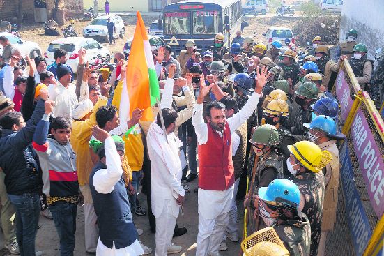 Farmers protest outside minister Anup Dhanak’s house