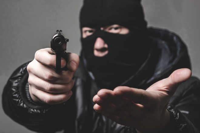 Man robbed of cash at gunpoint