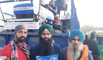 Farmers reach Singhu border with tractor-laden trailers