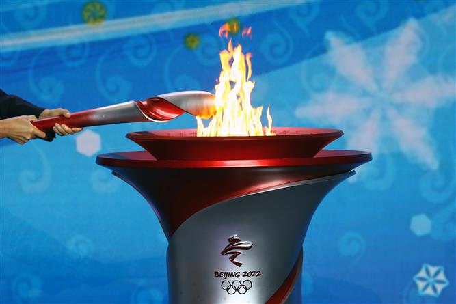 Beijing lights Olympic flame, to be first city to host summer, winter Games