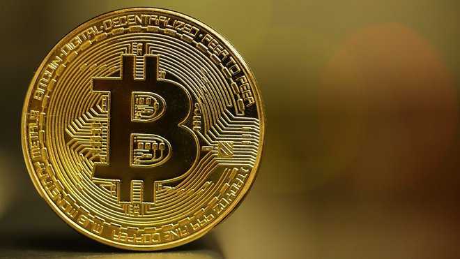 Bitcoin sets high, tops $66,000 on mainstreaming excitement