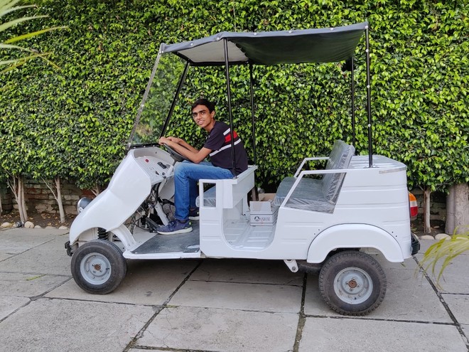City boy assembles electric cart for his school