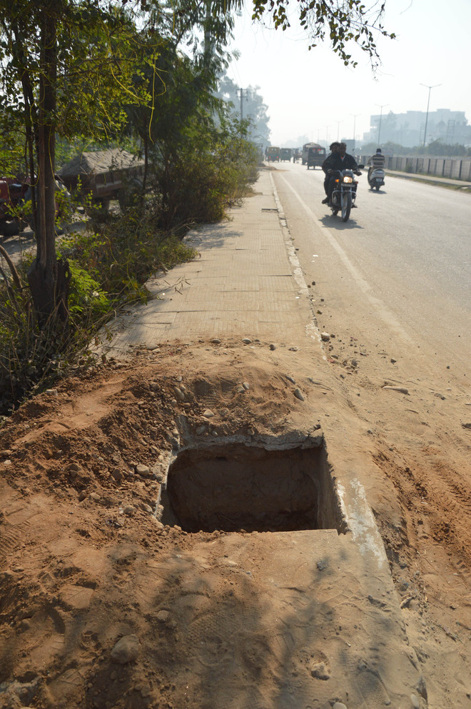 Open pits on footpath potential death traps near Ludhiana