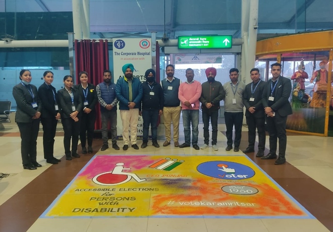 Students make rangoli at Sri Guru Ramdas International airport