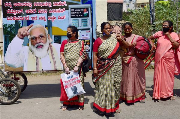 Use of PM’s photo in petrol pump hoardings violates poll code, should be removed: ECI official