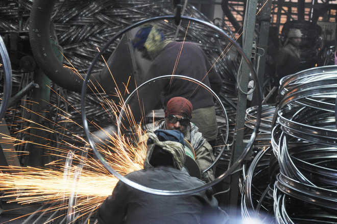 Manufacturing activities slightly ease in Feb; firms upbeat on demand spike: Survey