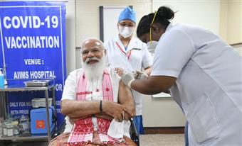 Modi takes first dose as age-specific Covid vaccine drive begins