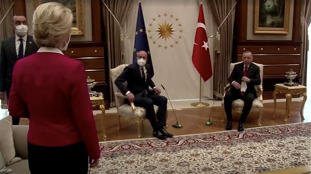 In video, as her male counterparts sit, EU president is left gawkily standing