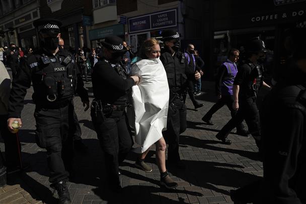 Topless woman arrested at Windsor Castle during royal funeral in UK