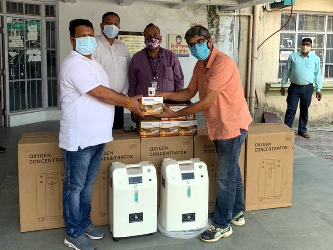 Oxygen concentrators handed over to Asha workers in Palampur