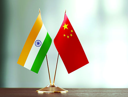 China reaches out amid surge, but India wary
