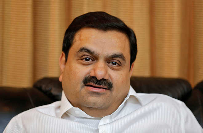 Adani shares fall after report says accounts frozen; erroneous, says group