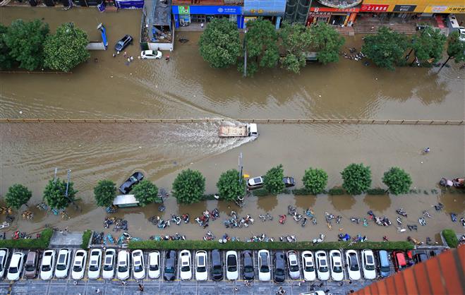 Tens of thousands evacuated as China storms spread northwards