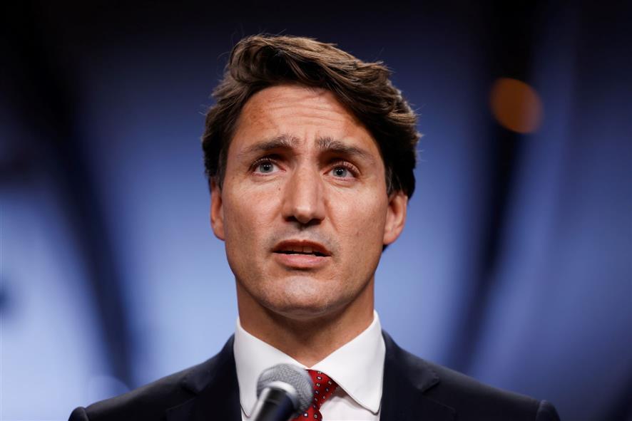 Canada's Justin Trudeau, trailing in polls, defends early election call
