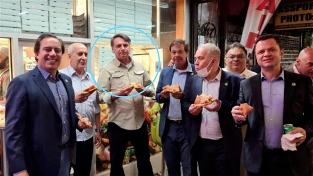 Unvaccinated Brazil President not allowed to enter New York's restaurants, eats pizza on a footpath