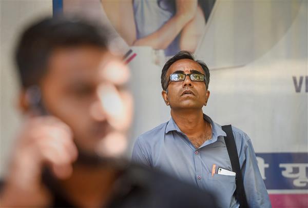 Markets maintain record run; Sensex breaches 59k for first time
