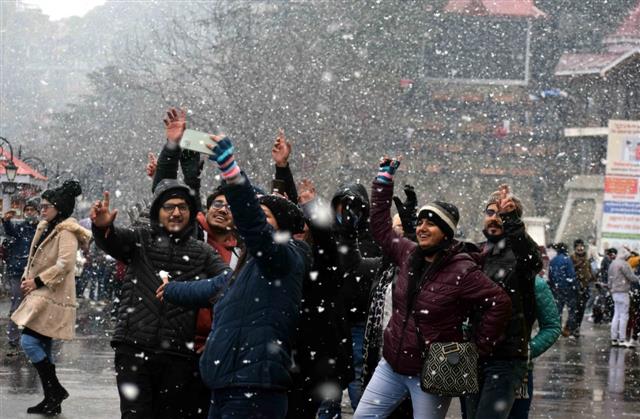 In pictures: Shimla gets mild snow; tourists overjoyed