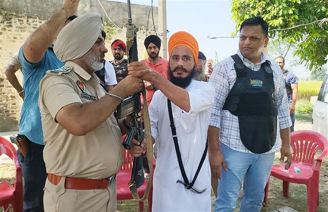 Peeved over police 'inaction', man snatches guard's rifle in Dhariwal