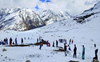 Tourists throng Rohtang Pass after snowfall
