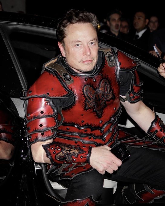 Elon Musk’s Halloween celebration: Carves Twitter bird on pumpkin, makes dog wear t-shirt with logo, dresses up in red and black leather armour