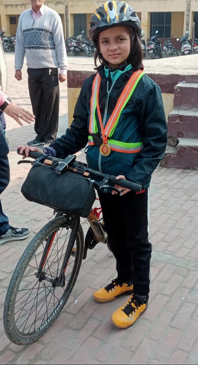 Environment, girl child theme for this 8-yr-old cyclist with a mission