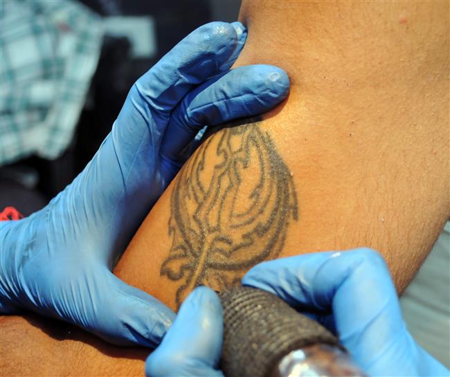 No tattoos of Sikh religious symbols or Gurbani verses, warns SGPC