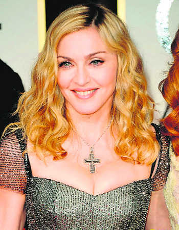 Madonna flashes bare bust after begging trolls to 'stop bullying' her