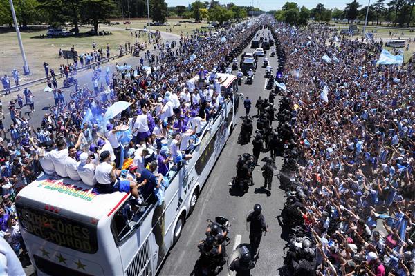 Argentina's FIFA World Cup champions airlifted in helicopters as fans swarm team bus
