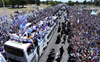 Argentina’s FIFA World Cup champions airlifted in helicopters as fans swarm team bus