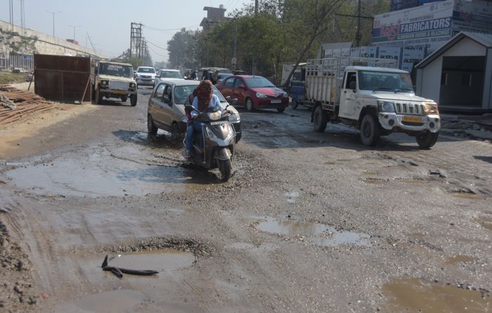 Poor condition of road near Sherpur Chowk irks motorists