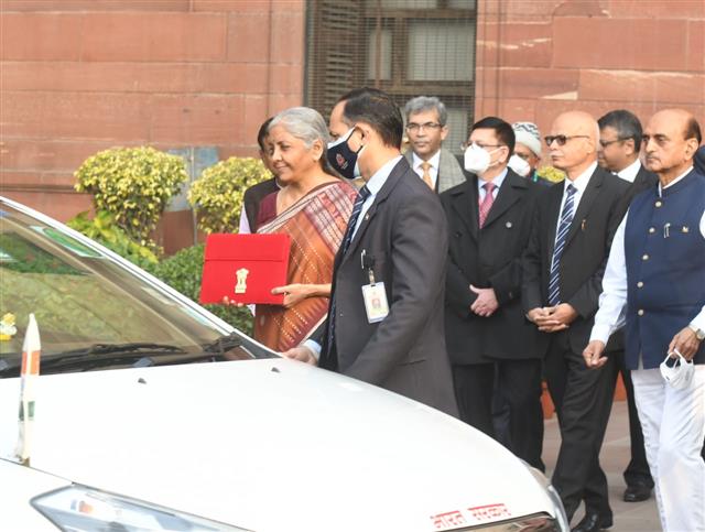 Sitharaman takes tablet in red pouch to Parliament to present paperless Budget