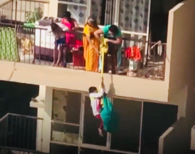 Video: Mother in Haryana's Faridabad lowers kid from 9th to 8th floor using bedsheet to fetch her sari