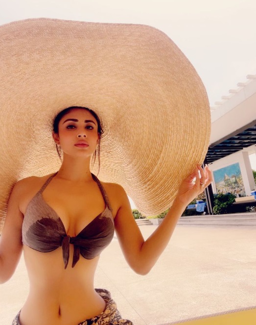 Mouni Roy sets temperature soaring in these bikini shots… guess who is she holidaying with; no, it's not Suraj